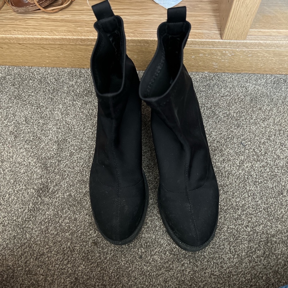 Black nylon heeled boots with rubber sole